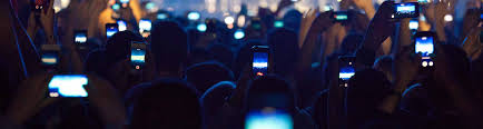 People at a concert recording the show with phones